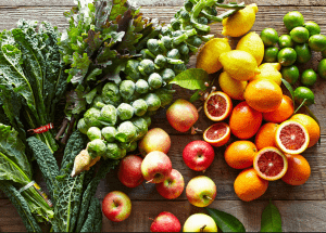 a group of fruits and vegetables on a wood surface Healthy Weight Loss Diets Midlands